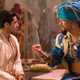 Mena Massoud is Aladdin and Will Smith is the genie in Aladdin.